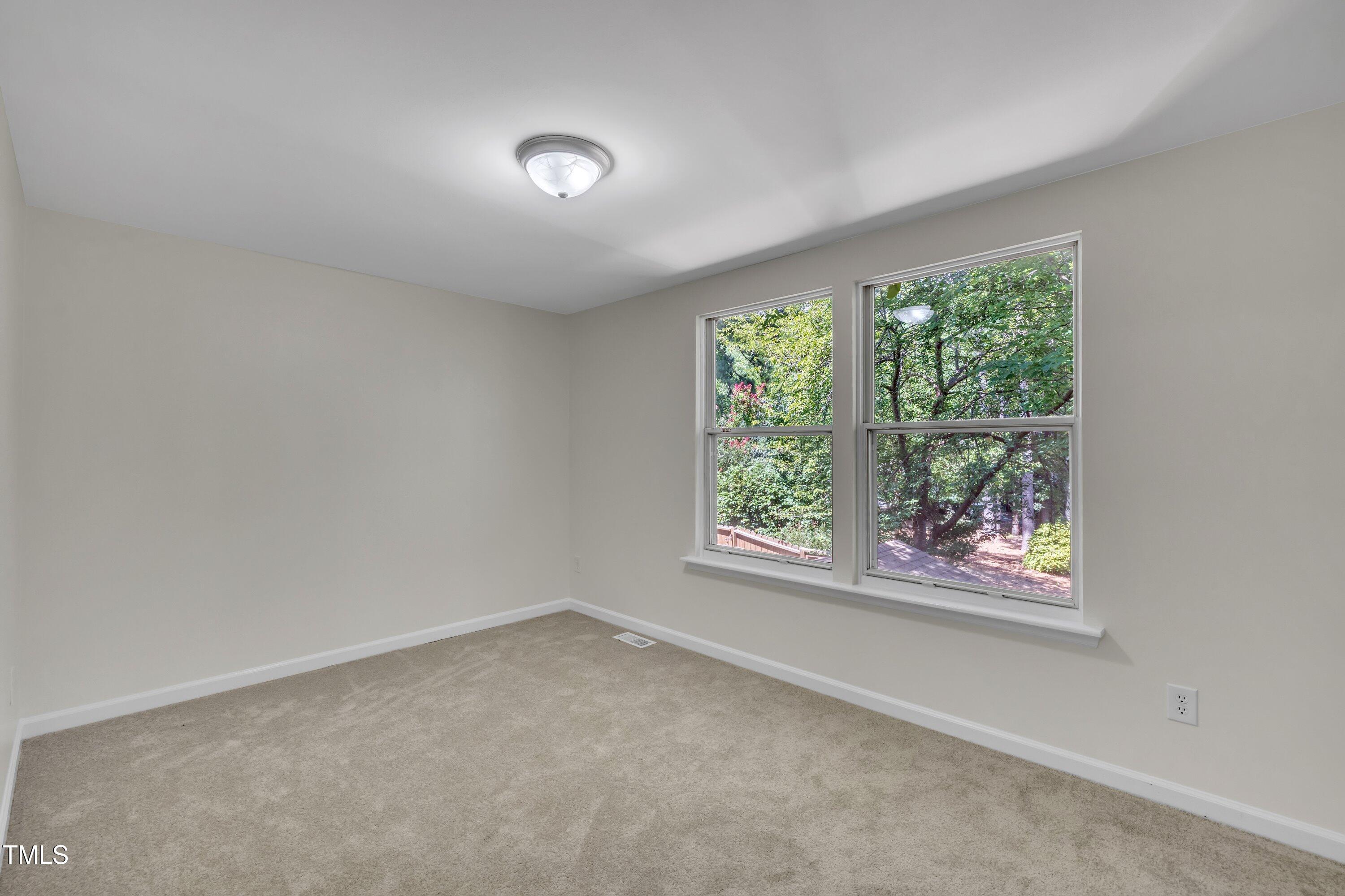 632 Middleton Avenue Cary, NC 27513 - Photo 26 of 34 an empty room with windows