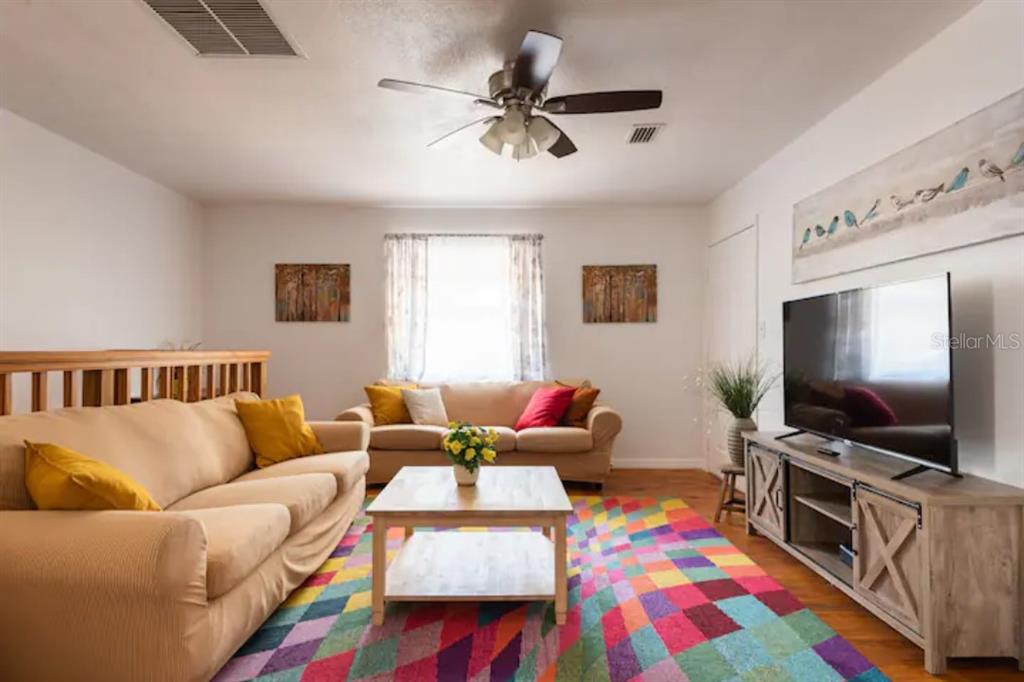 368 Ridge Road Southwest Largo, FL 33770 - Photo 12 of 46 a living room with furniture and a flat screen tv