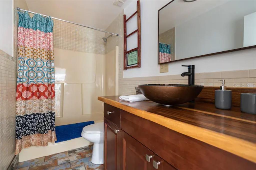 368 Ridge Road Southwest Largo, FL 33770 - Photo 25 of 46 a bathroom with a sink and a mirror