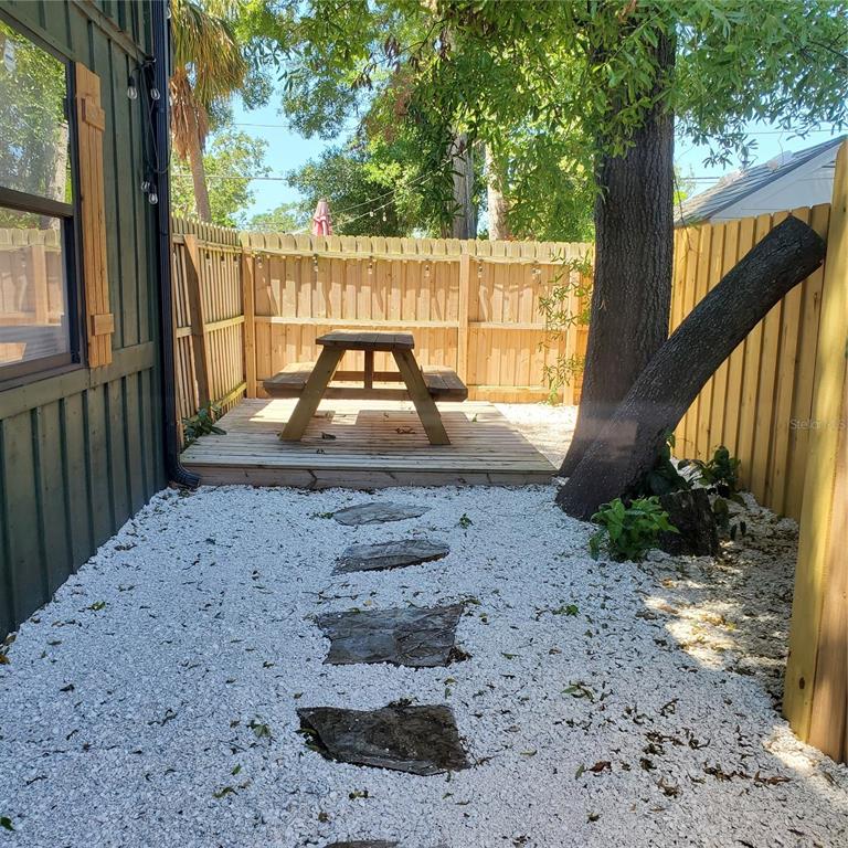 368 Ridge Road Southwest Largo, FL 33770 - Photo 27 of 46 a view of a yard with a sink and wooden fence