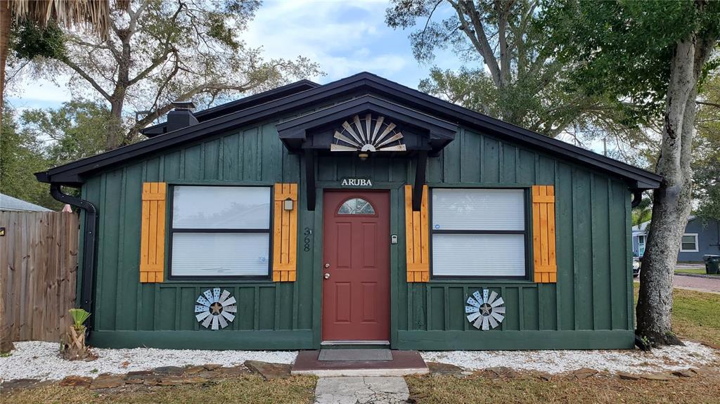 368 Ridge Road Southwest Largo, FL 33770 - Photo 28 of 46 a front view of a house with garden