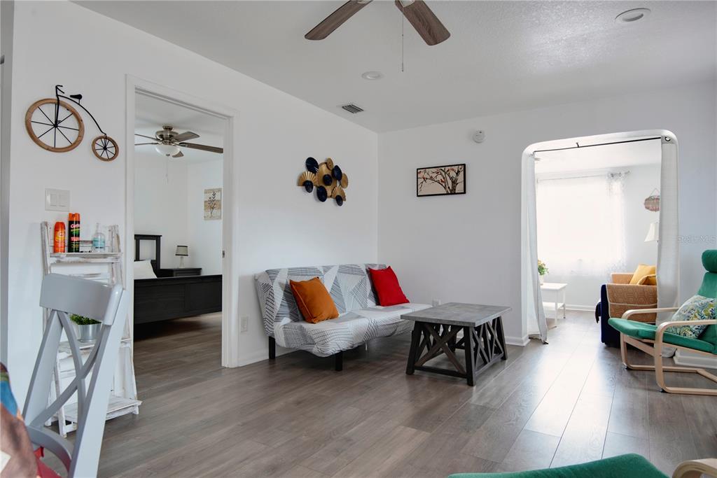 368 Ridge Road Southwest Largo, FL 33770 - Photo 33 of 46 a living room with furniture and a wooden floor