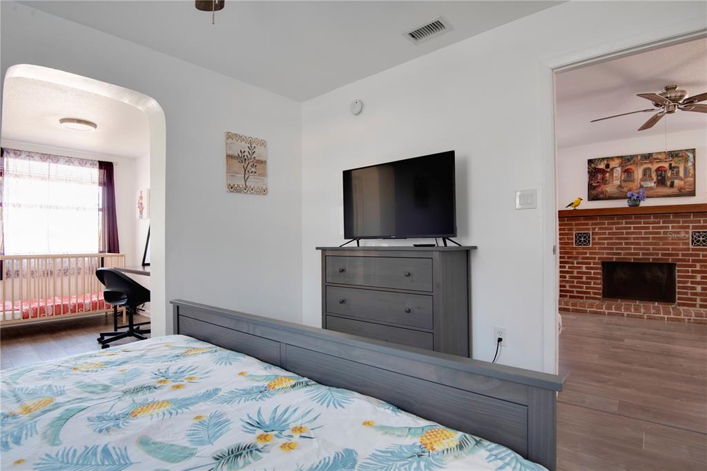 368 Ridge Road Southwest Largo, FL 33770 - Photo 37 of 46 a bedroom with a bed and a flat screen tv
