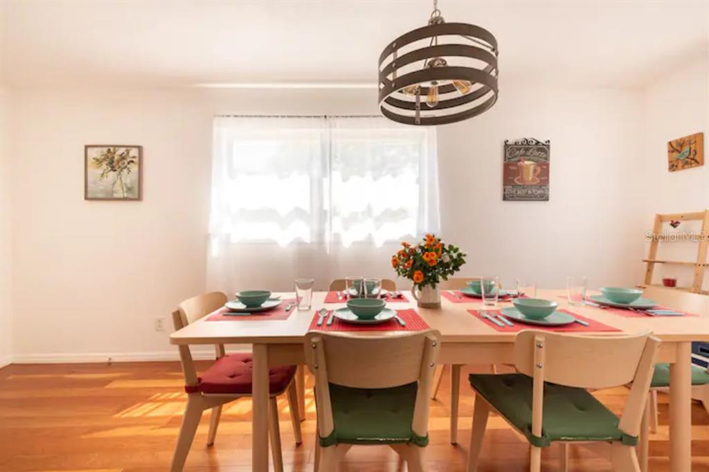 368 Ridge Road Southwest Largo, FL 33770 - Photo 10 of 46 a view of a dining room with furniture and chandelier