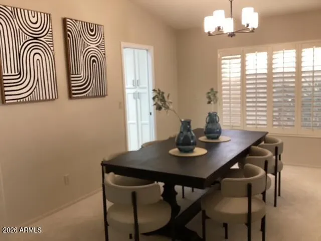 a bathroom with a granite countertop sink a mirror and shower