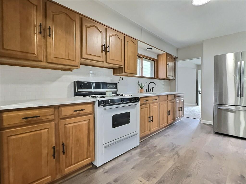 91 Blanche Road Fredericktown, PA 15333 - Photo 14 of 41 a kitchen with stainless steel appliances granite countertop cabinets and a refrigerator