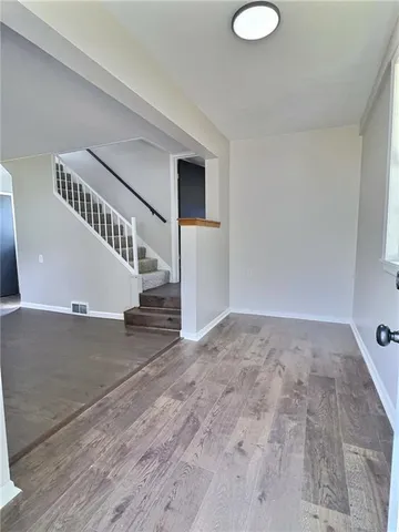 a view of entryway with wooden floor