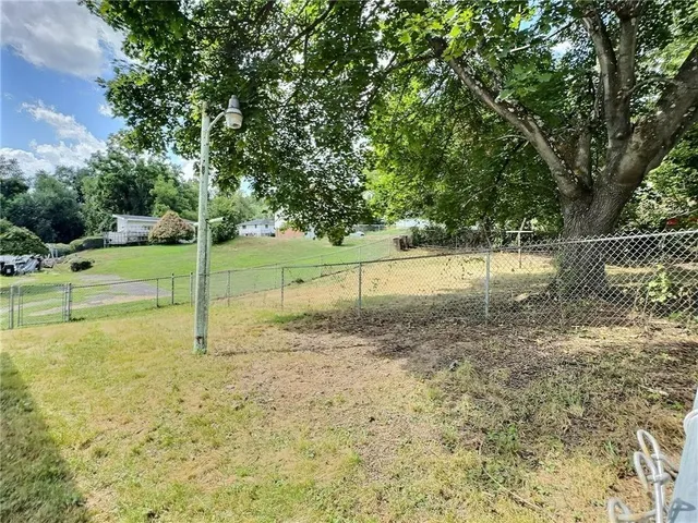 a view of a yard with a slide