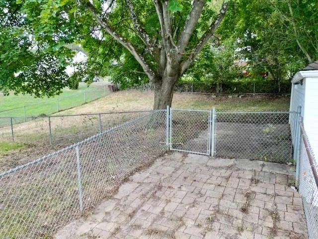a backyard of a house with lots of green space