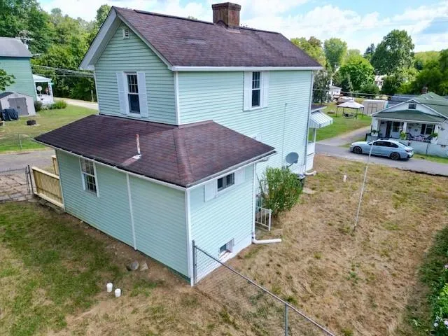 a aerial view of a house with a yard