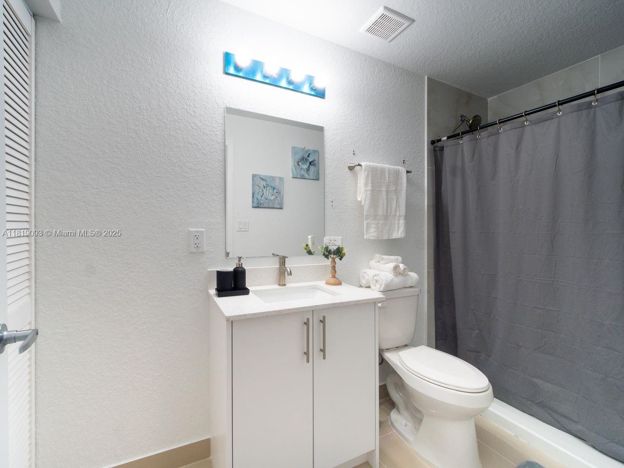 25718 Southwest 143rd Path Homestead, FL 33032 - Photo 15 of 26 a bathroom with a sink toilet and shower