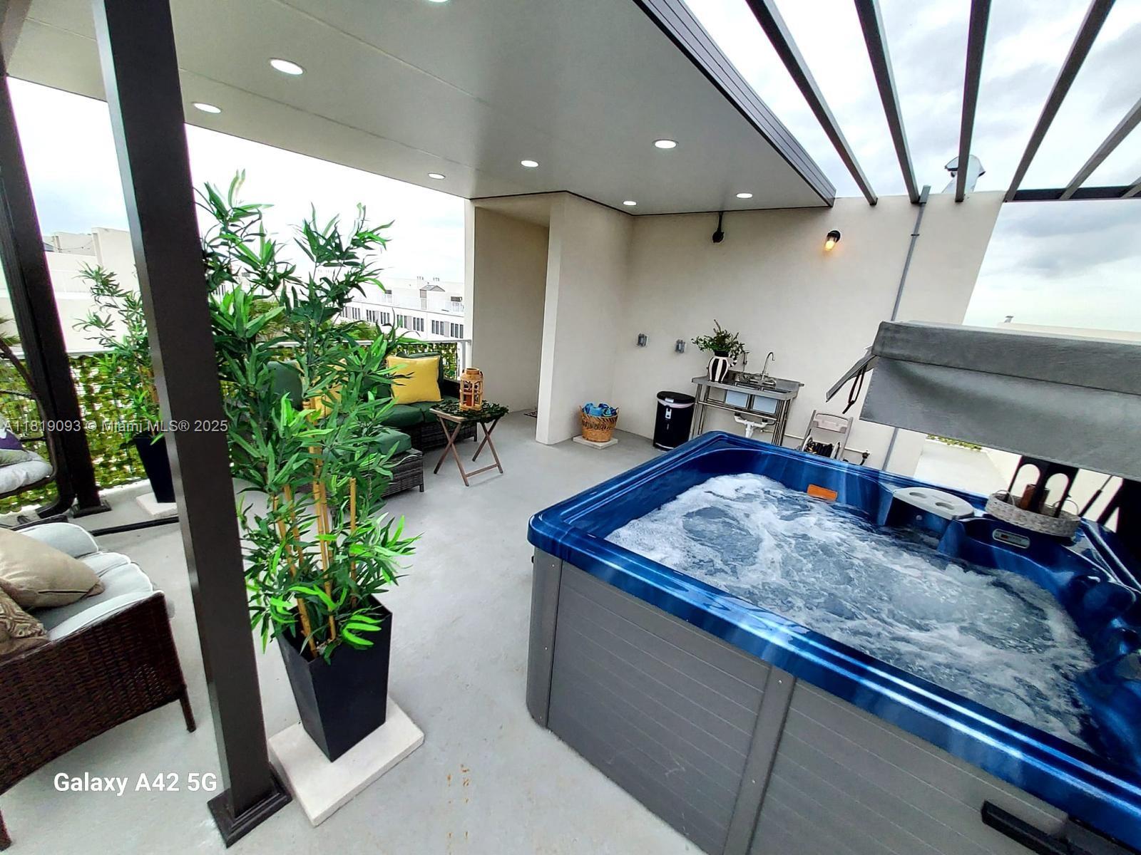 25718 Southwest 143rd Path Homestead, FL 33032 - Photo 25 of 26 a room with furniture and potted plant