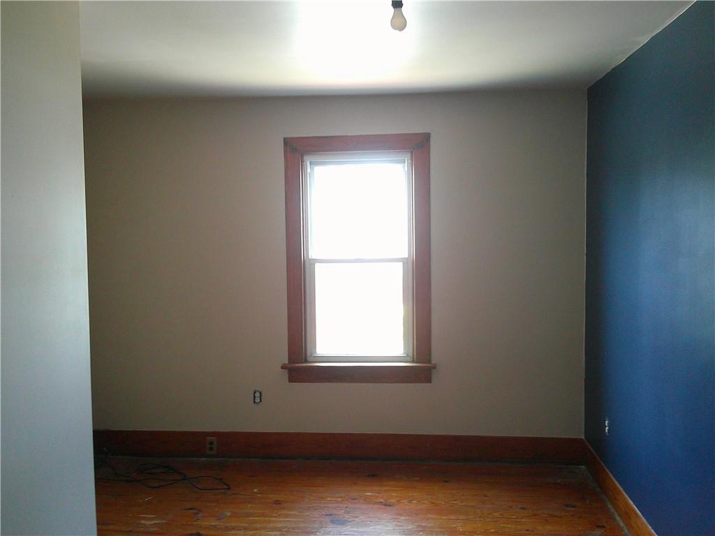 152 East Garrett Street Somerset, PA 15501 - Photo 11 of 18 an empty room with wooden floor and windows