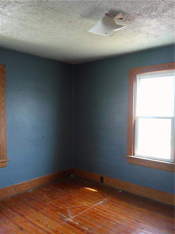 152 East Garrett Street Somerset, PA 15501 - Photo 13 of 18 an empty room with wooden floor and windows