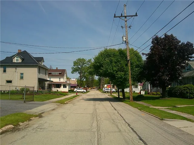 a front view of a building with garden