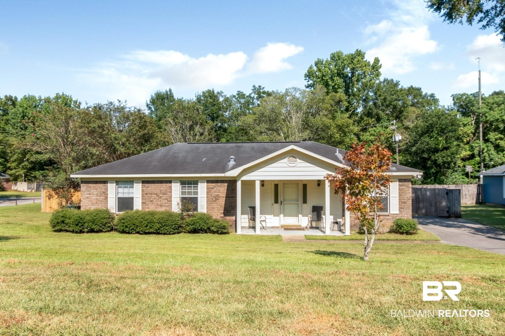 1345 Camden Court Mobile, AL 36695 - Photo 1 of 31 Ranch-style house featuring brick siding, a porch, and a front lawn