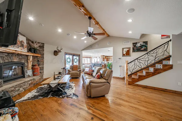 a very nice looking living room with a large window and furniture