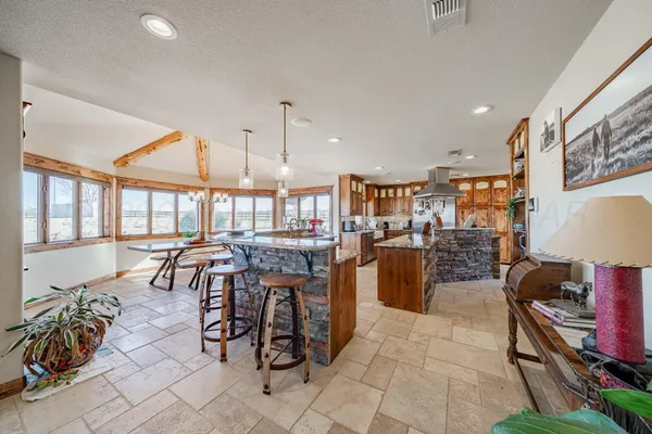 a room with lots of table and chairs