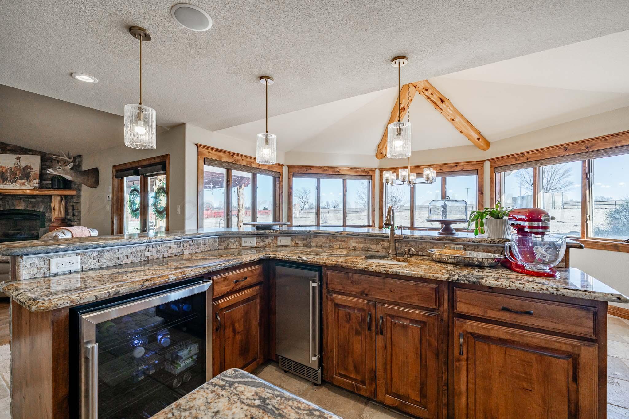 1000 Osage Street Wheeler, TX 79096 - Photo 19 of 57 a kitchen with a sink and a wooden floor