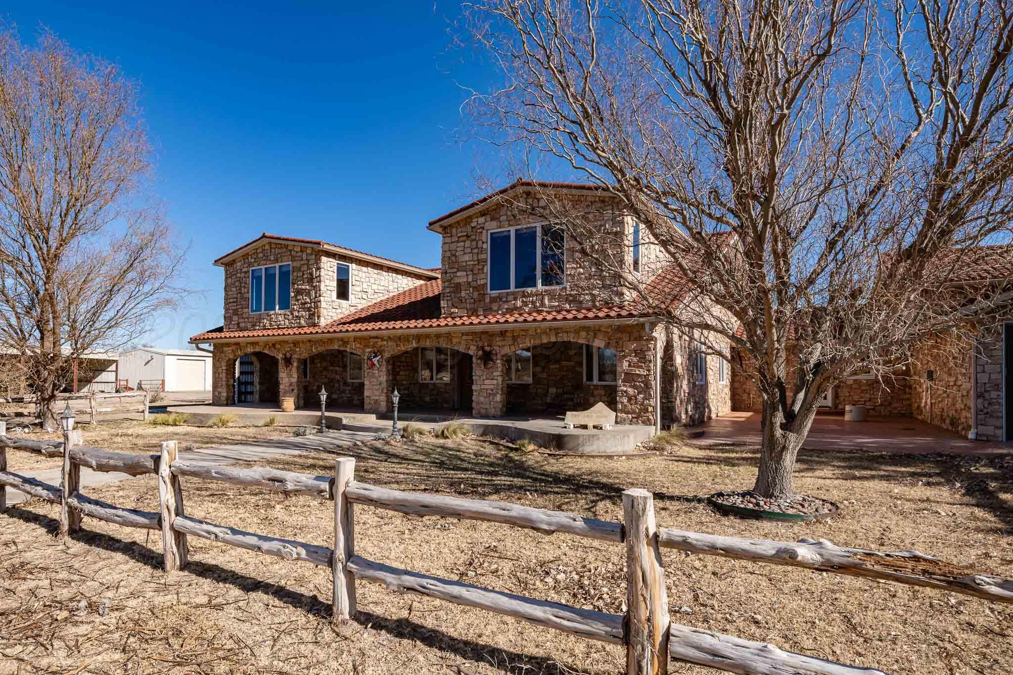 1000 Osage Street Wheeler, TX 79096 - Photo 2 of 57 a front view of a house with large trees