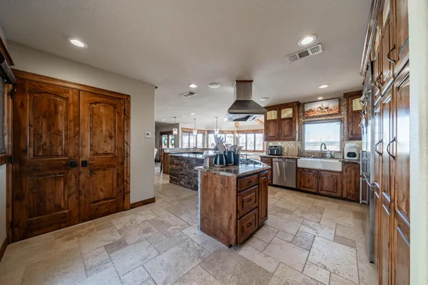 a kitchen with a refrigerator and a sink