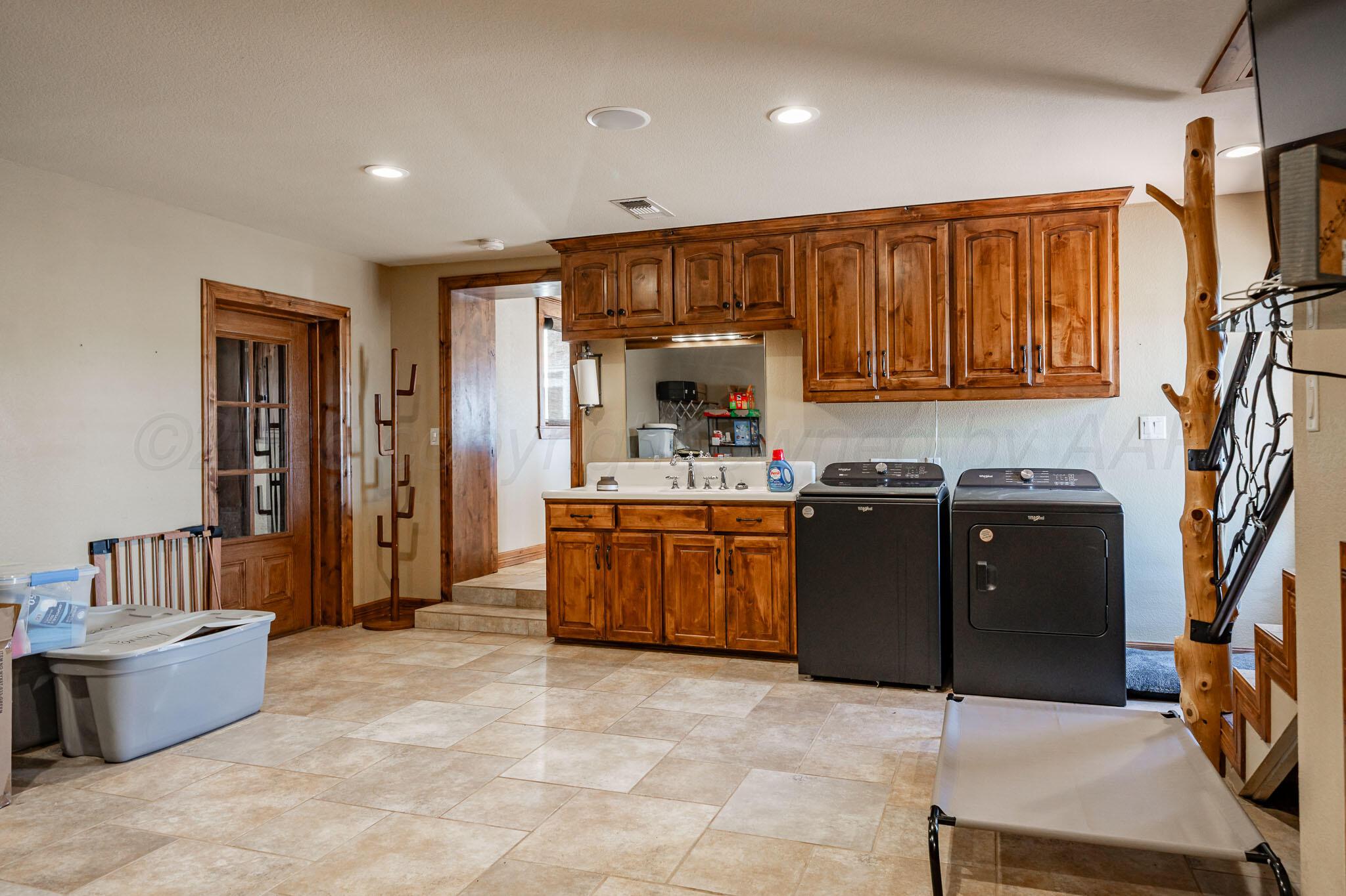 1000 Osage Street Wheeler, TX 79096 - Photo 24 of 57 a kitchen with a refrigerator and a sink