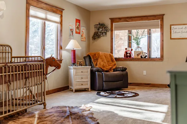 a view of a livingroom with furniture and a window