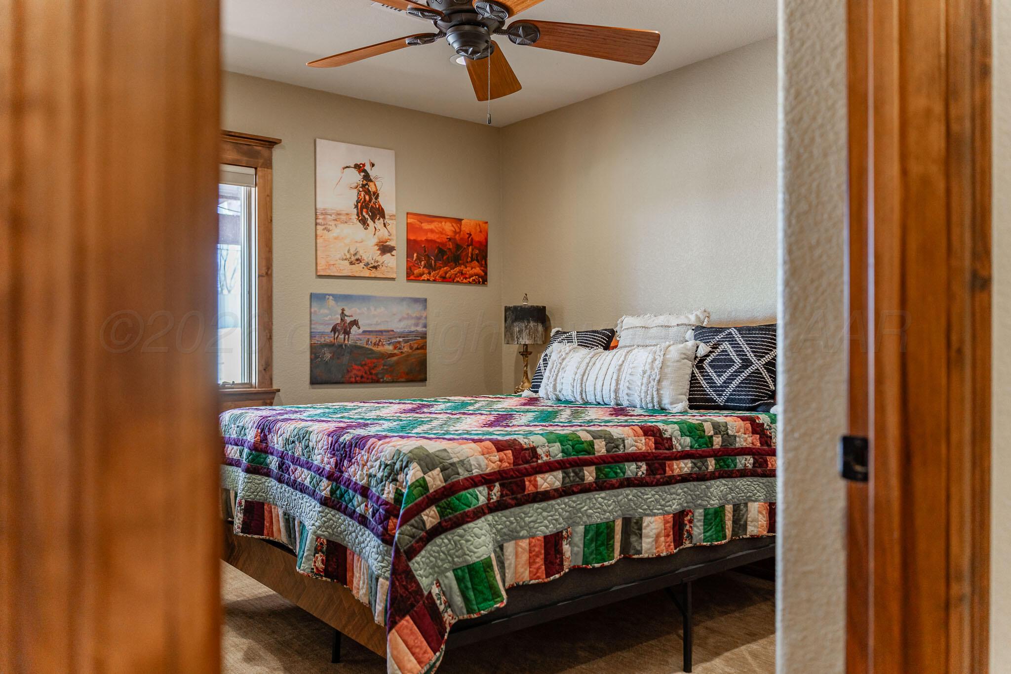 1000 Osage Street Wheeler, TX 79096 - Photo 35 of 57 a bedroom with bed and wooden floor
