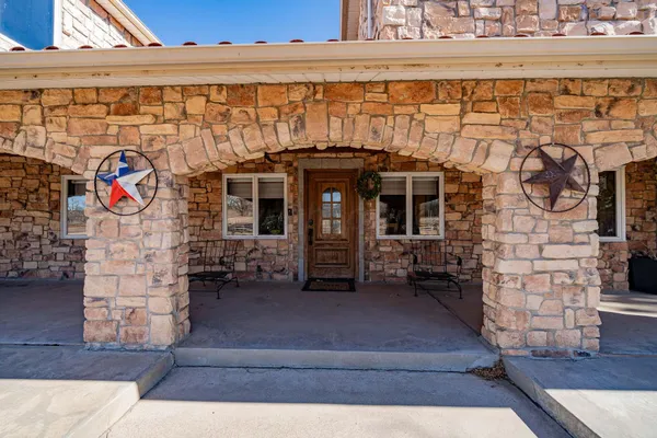 a view of front door and outdoor seating