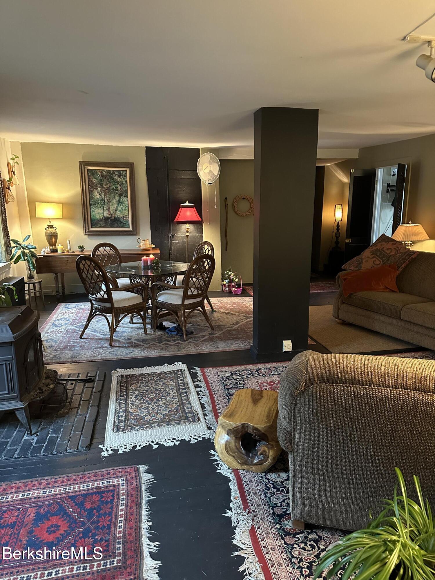 27 North Main Road Otis, MA 01253 - Photo 4 of 24 a living room with furniture and a potted plant