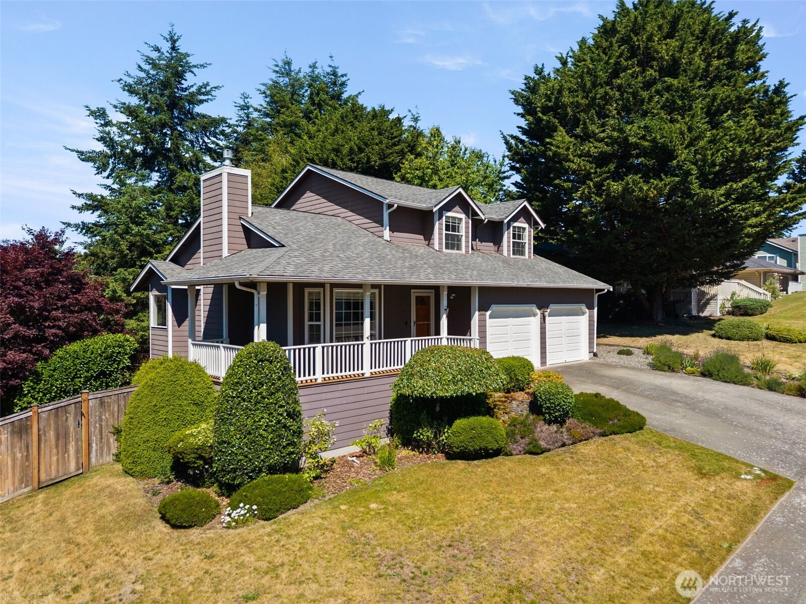 26227 Montera Loop Northeast Kingston, WA 98346 - Photo 2 of 22 a front view of a house with a yard