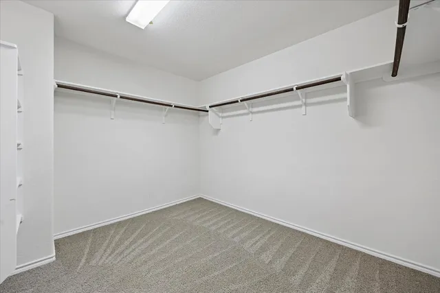 a view of a room with shelf on the wall