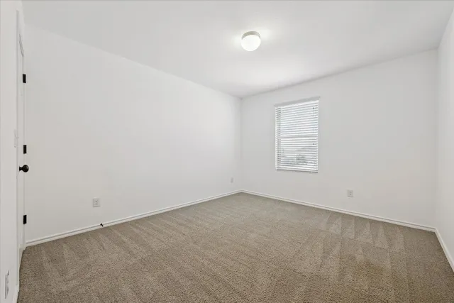 an empty room with a empty space and window