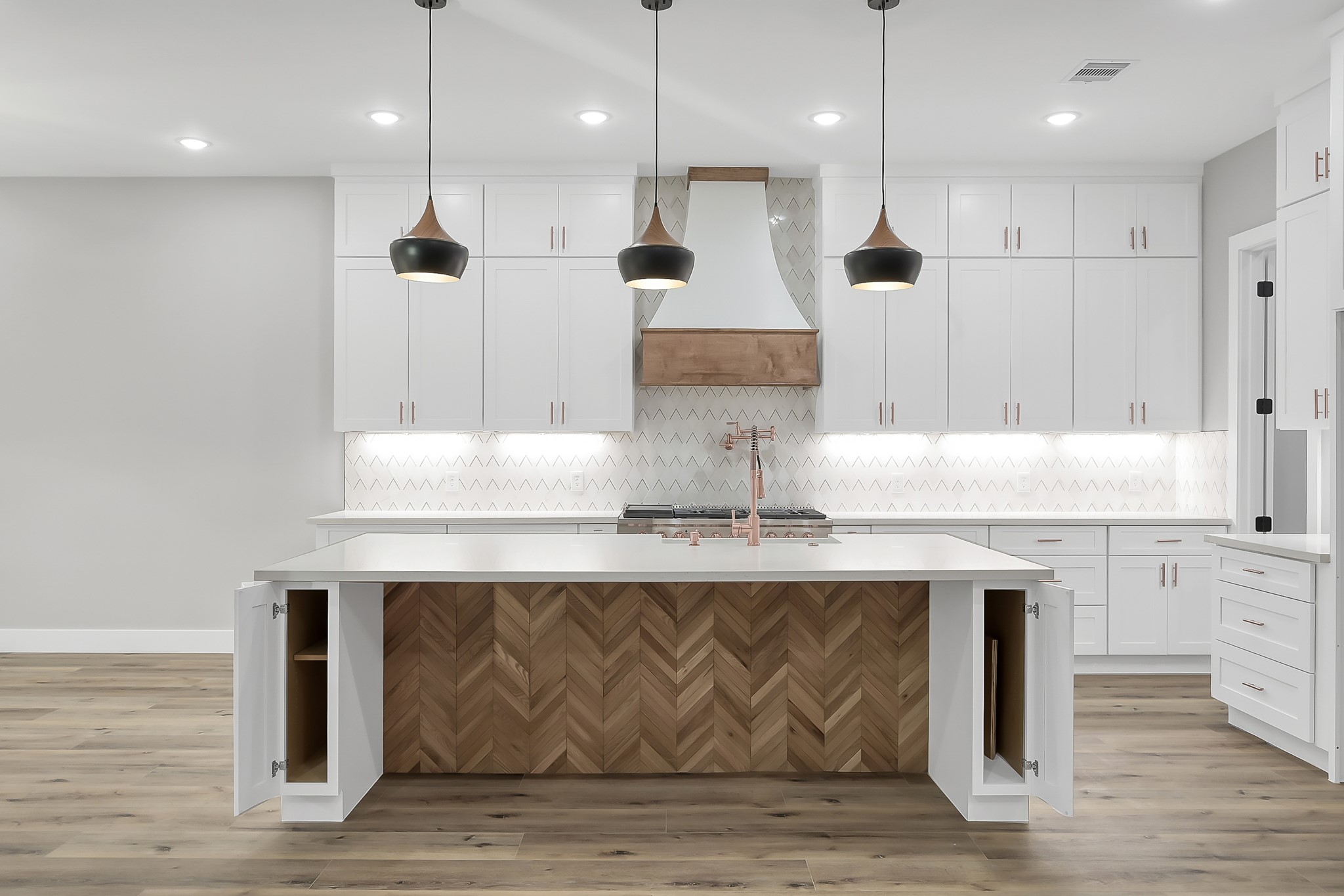 135 Wick Willow Road Montgomery, TX 77356 - Photo 13 of 48 a kitchen with kitchen island stainless steel appliances a sink stove and cabinets