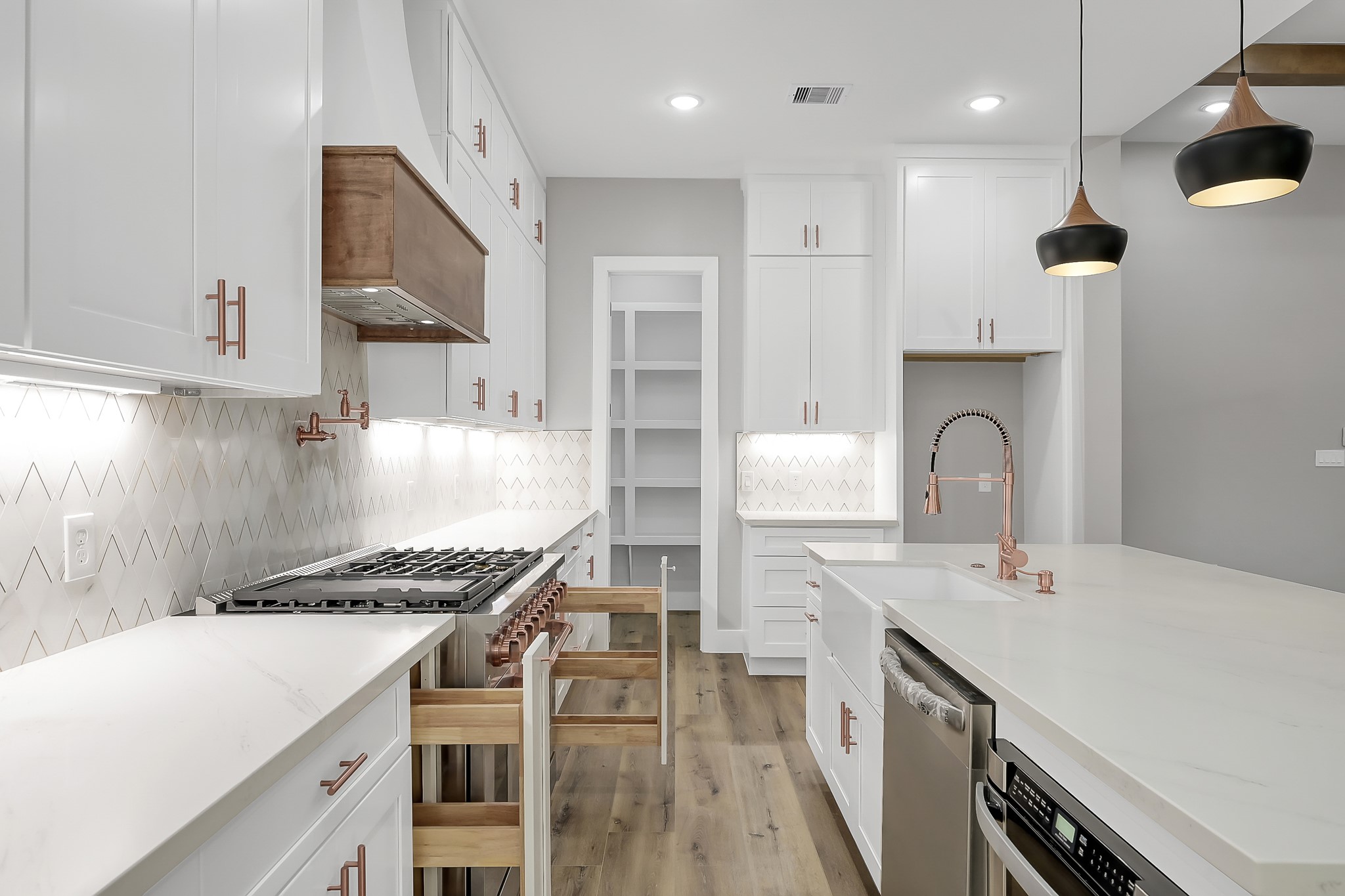 135 Wick Willow Road Montgomery, TX 77356 - Photo 17 of 48 a kitchen with a sink stainless steel appliances and cabinets
