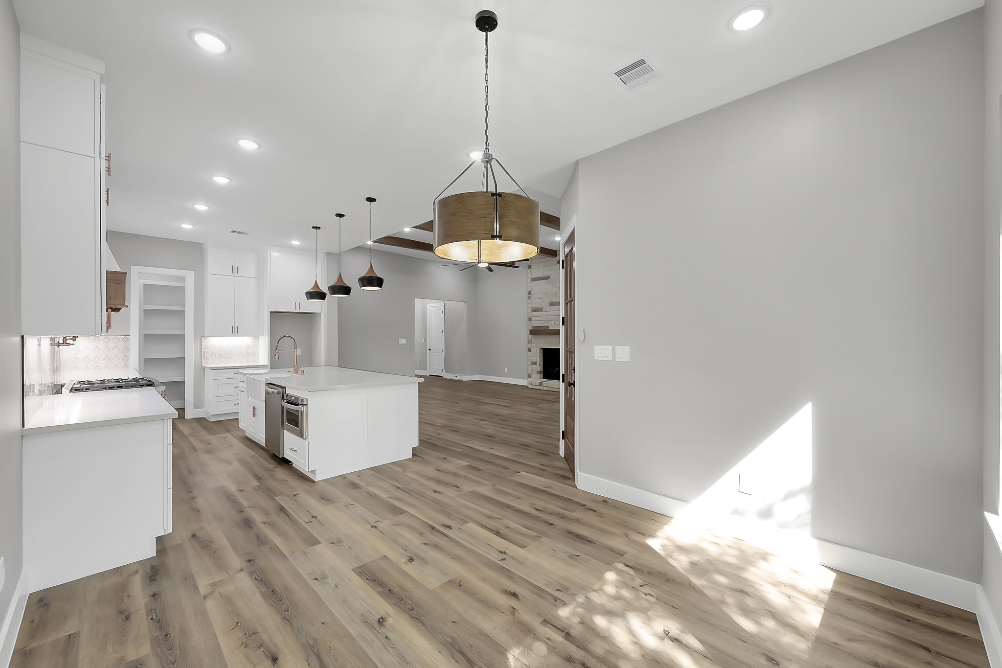 135 Wick Willow Road Montgomery, TX 77356 - Photo 22 of 48 a view of a kitchen with kitchen island a counter top space a sink a refrigerator and a window