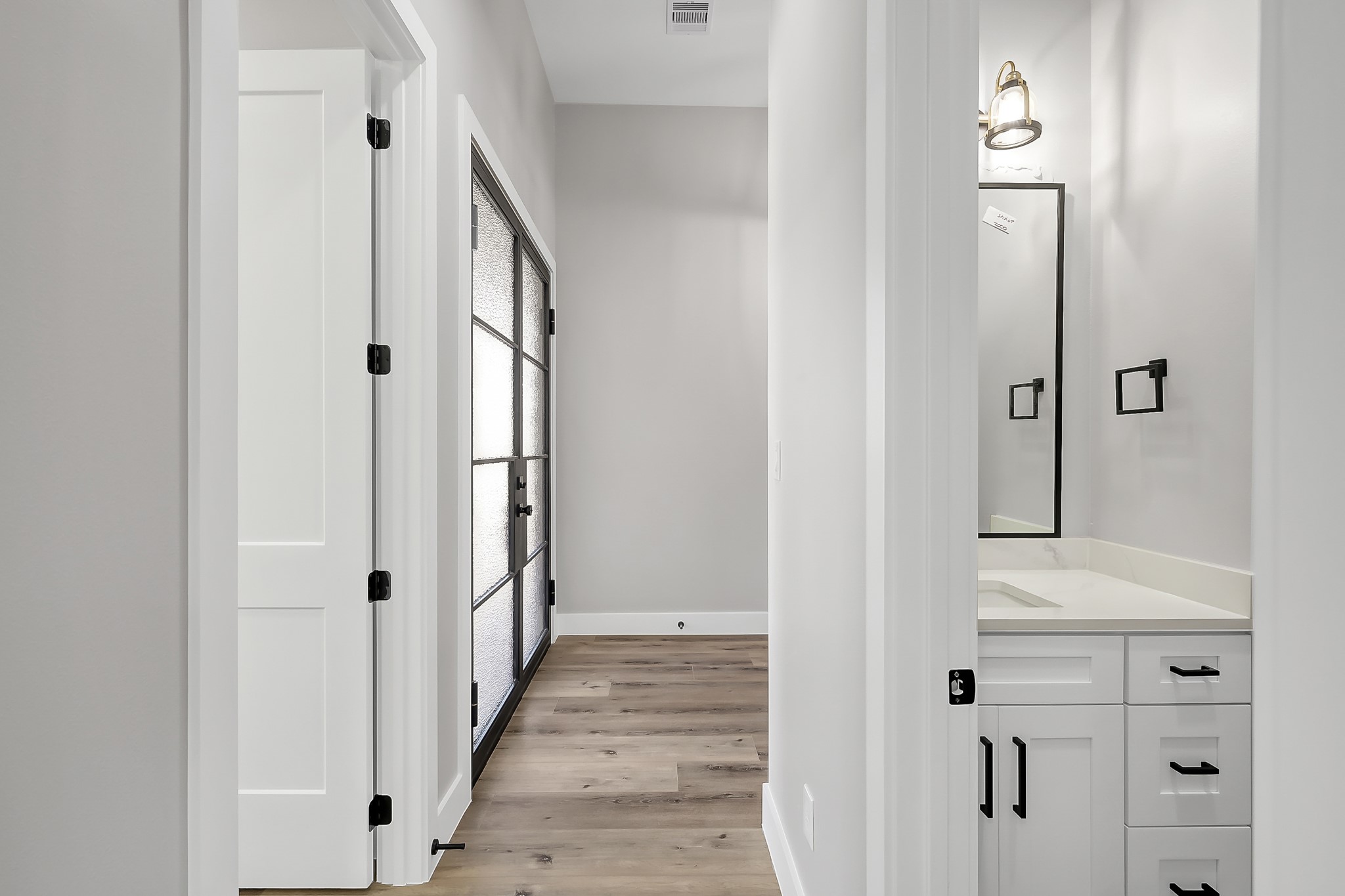 135 Wick Willow Road Montgomery, TX 77356 - Photo 34 of 48 a view of a hallway with wooden floor and entryway