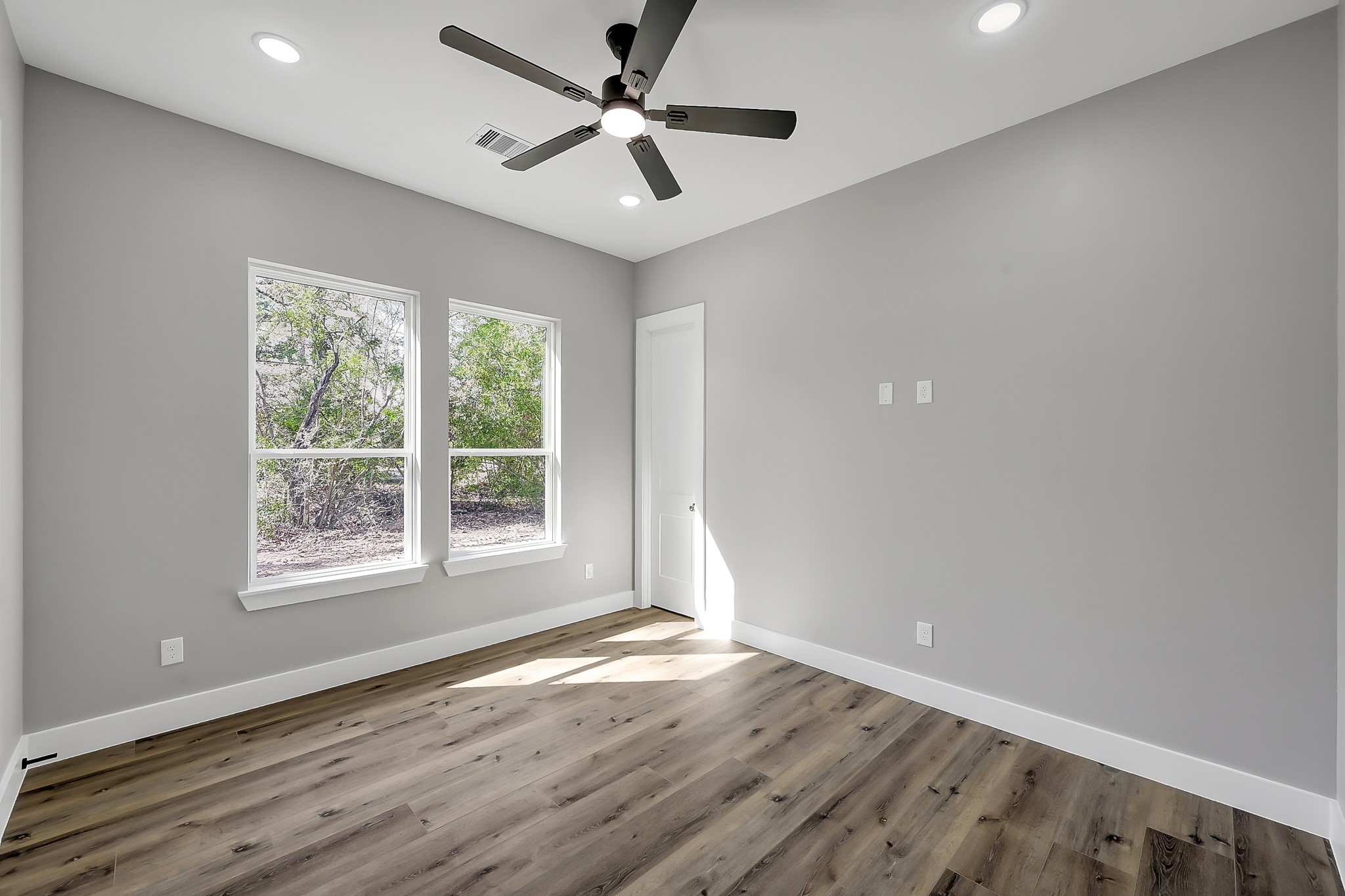 135 Wick Willow Road Montgomery, TX 77356 - Photo 37 of 48 a view of an empty room with wooden floor and a window