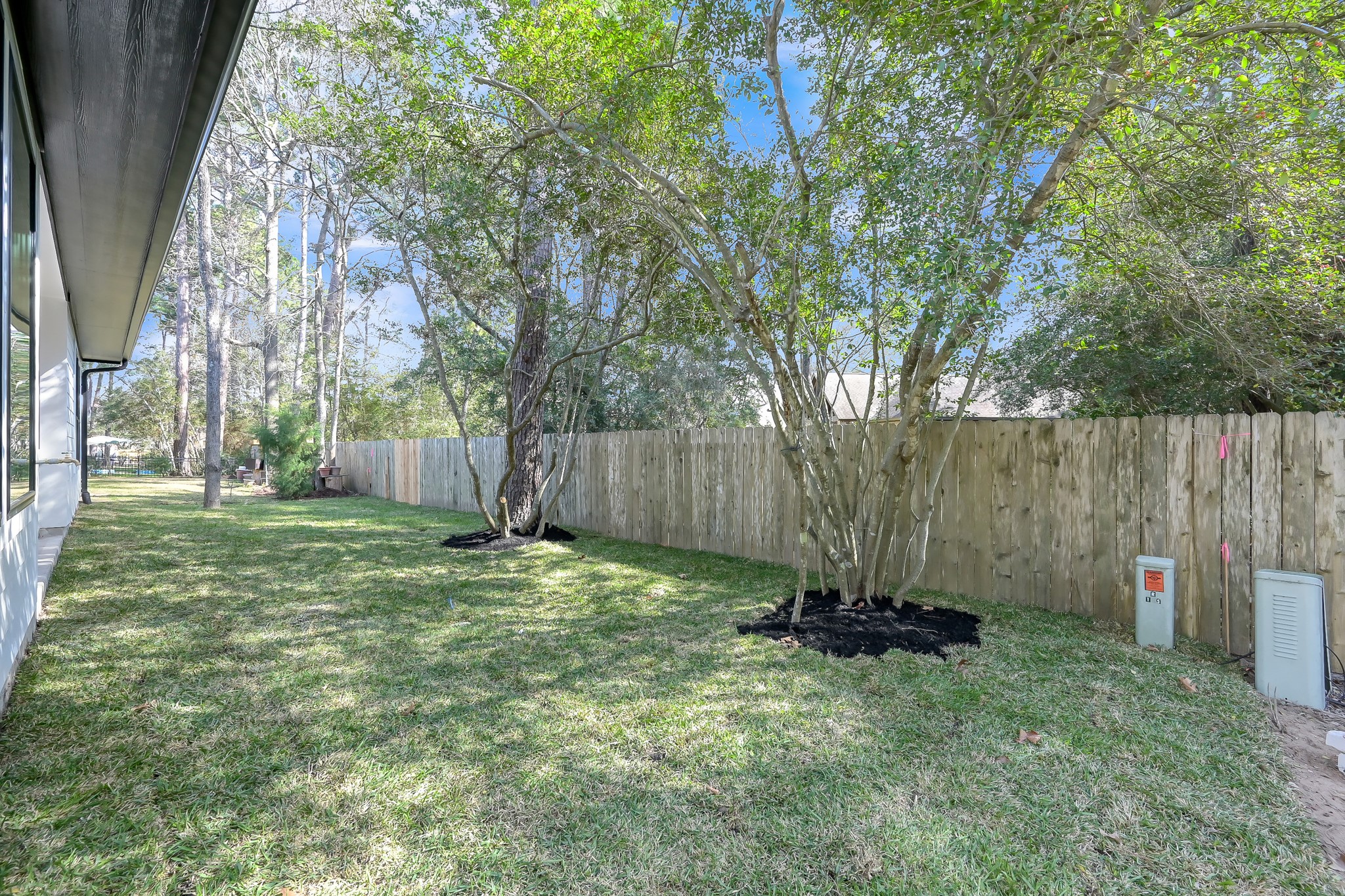 135 Wick Willow Road Montgomery, TX 77356 - Photo 46 of 48 a backyard of a house with lots of green space