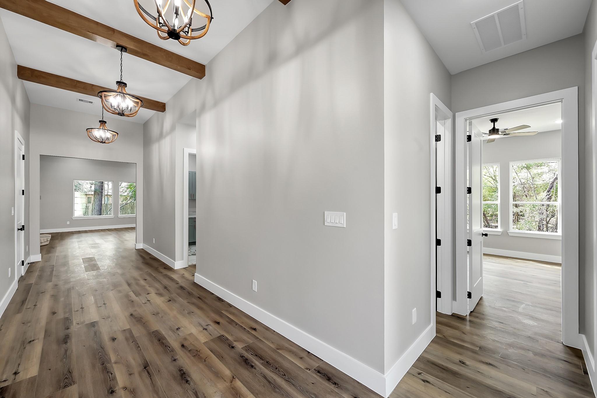 135 Wick Willow Road Montgomery, TX 77356 - Photo 7 of 48 a view of a hallway with wooden floor and staircase