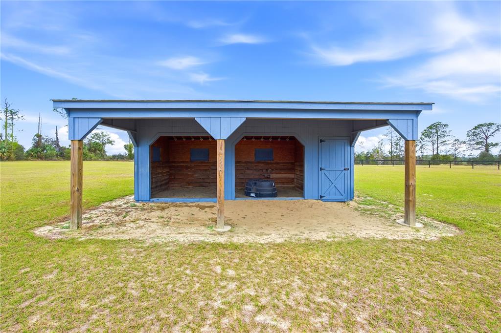 5608 Strong Point Weirsdale, FL 32195 - Photo 11 of 56 a view of back yard of a house