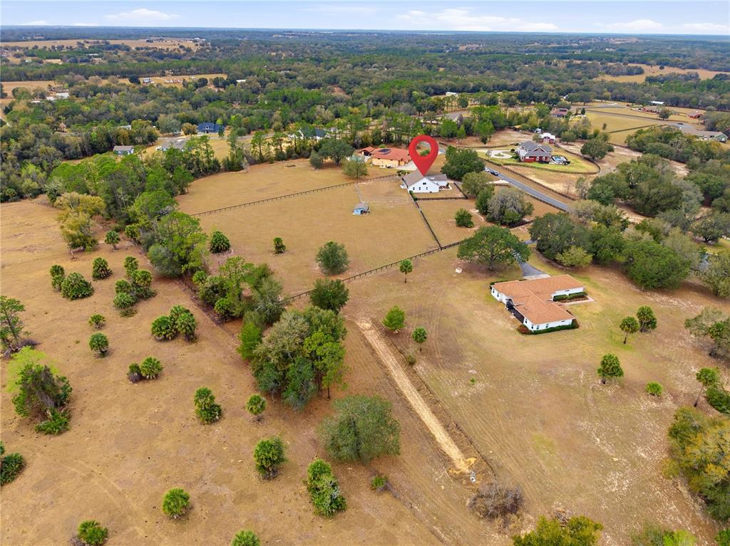 5608 Strong Point Weirsdale, FL 32195 - Photo 13 of 56 an aerial view of residential houses with outdoor space