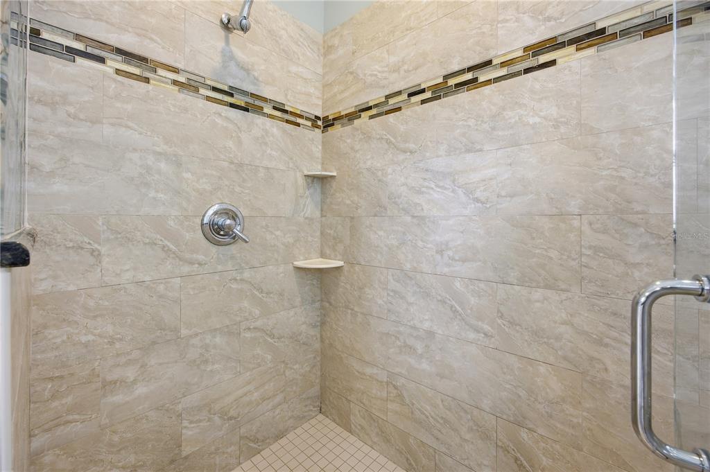 5608 Strong Point Weirsdale, FL 32195 - Photo 37 of 56 a bathroom with a shower