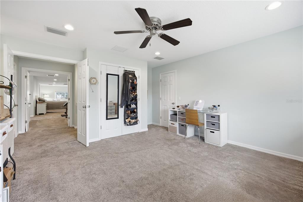 5608 Strong Point Weirsdale, FL 32195 - Photo 46 of 56 a view of a livingroom with a furniture and chandelier fan