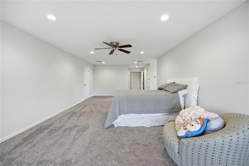 5608 Strong Point Weirsdale, FL 32195 - Photo 51 of 56 a living room with furniture and a chandelier