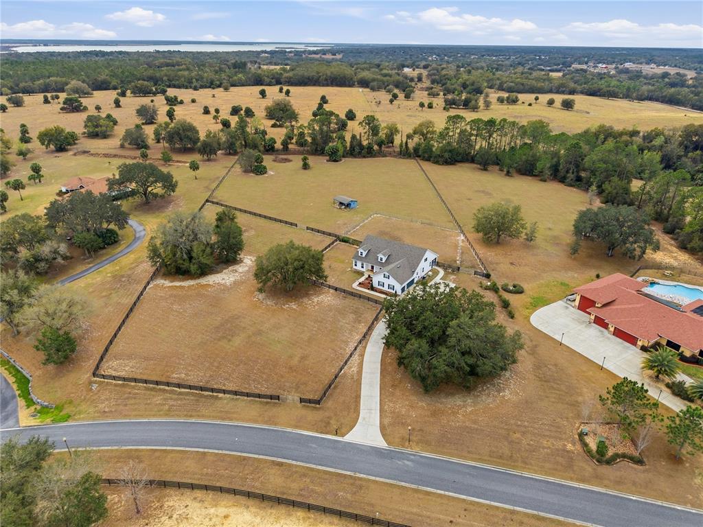 5608 Strong Point Weirsdale, FL 32195 - Photo 9 of 56 an aerial view of residential houses with outdoor space