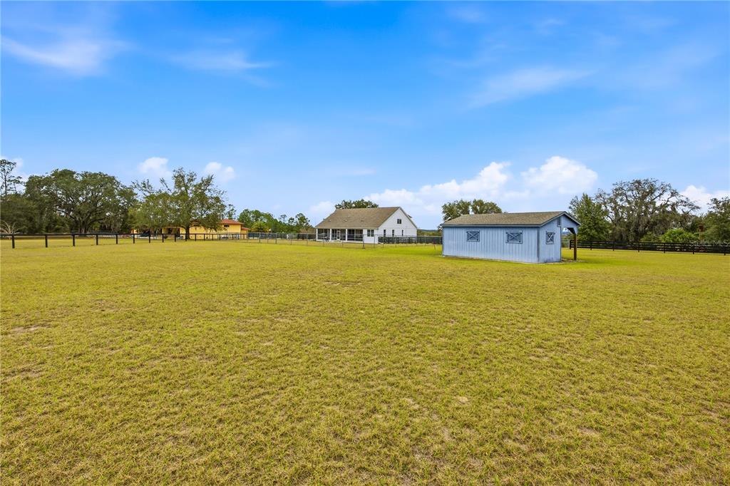 5608 Strong Point Weirsdale, FL 32195 - Photo 10 of 56 a view of a ocean with palm trees