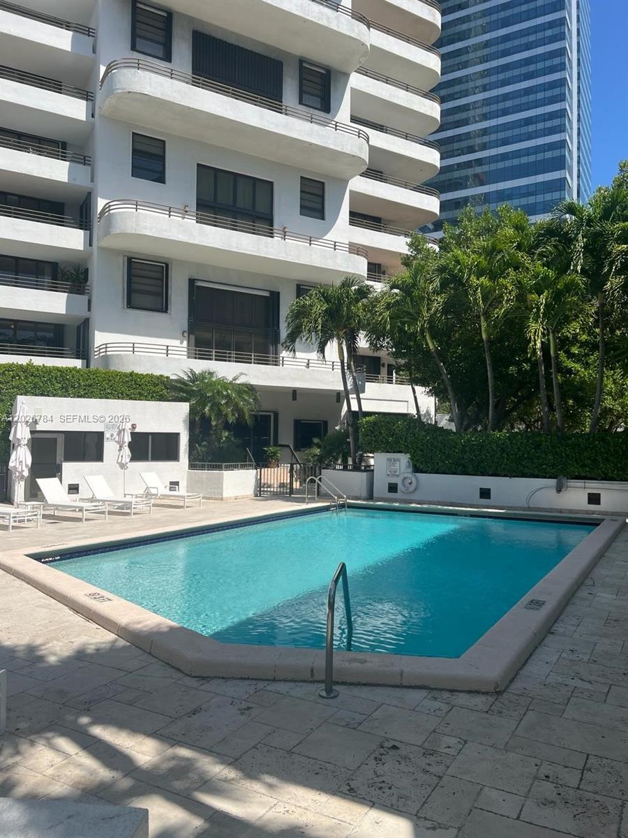 151 Southeast 15th Road, Unit 601 Miami, FL 33129 - Photo 32 of 36 a view of a house with a swimming pool