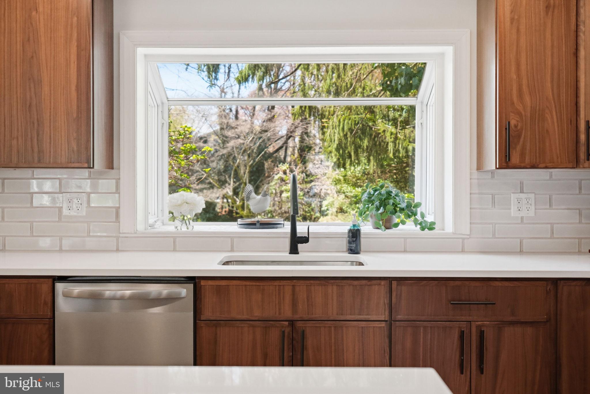 409 South Providence Road Wallingford, PA 19086 - Photo 33 of 106 Bright kitchen with serene garden view.