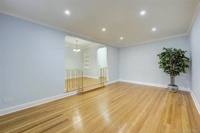 a living room with furniture a rug and a wall painting